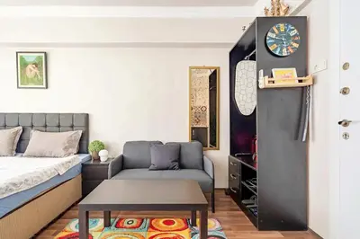 a bedroom with a bed and a couch and a table at 1st Floor Historic Flat in Old Istanbul in Istanbul