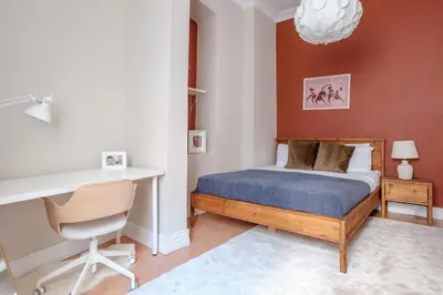 a bedroom with a bed and a desk at Urban Balcony Suite - Close to Taksim in Istanbul