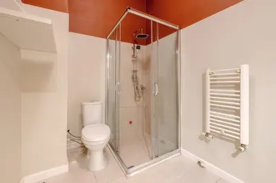 a bathroom with a shower and a toilet at Urban Balcony Suite - Close to Taksim in Istanbul