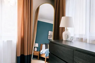 a bedroom with a dresser with a mirror on it at Stylish Flat w Balcony – 5 Mins from Taksim Square in Istanbul