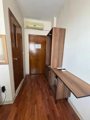 a room with a wooden desk and a door at Otel Parpali in Istanbul