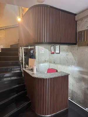a bar in a restaurant with stairs behind it at Otel Parpali in Istanbul