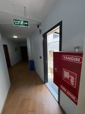 an empty room with a sign on the wall at Ferah Otel in Gebze