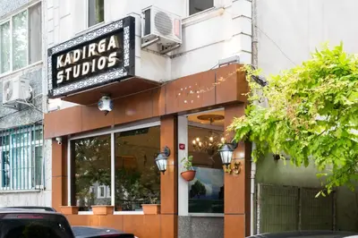 a store with a sign on the side of a building at Kadirga Studios in Istanbul