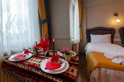 a hotel room with a bed and two plates of food at Kadirga Studios in Istanbul