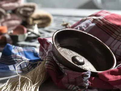 a brown hat sitting on top of a blanket at Antusa Palace Hotel & Spa in Istanbul