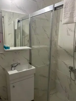 a bathroom with a shower and a sink at Oldmile Palace Hotel in Istanbul