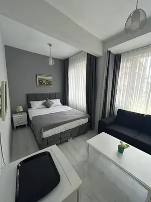 a hotel room with a bed and a couch at Oldmile Palace Hotel in Istanbul