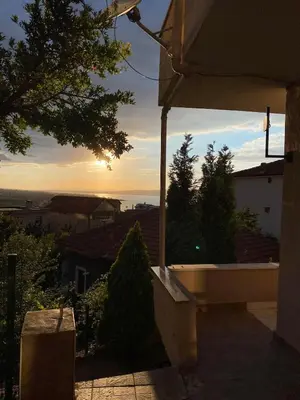 a view of the sunset from a balcony of a house at bahçeli ve göl manzaralı ev in Sapanca