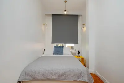 a bedroom with a bed and a white wall at Bosphorus View with 5 Bedrooms and Elevator in Istanbul