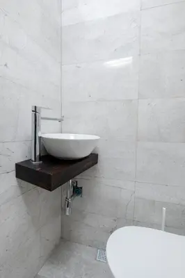 a white bathroom with a sink and a tub at 3 Bedrooms and Central Location in Istanbul
