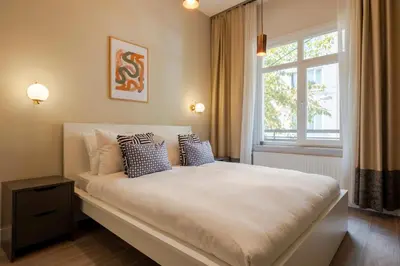 a bedroom with a large white bed with a window at 3 Bedrooms and Central Location in Istanbul