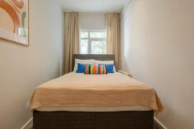 a bedroom with a large bed with colorful pillows at 3 Bedrooms and Central Location in Istanbul