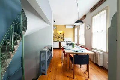 a kitchen and dining room with a table and chairs at 3 Bedroom, 2 Bathroom Fully Equipped House in Istanbul