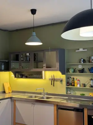 a kitchen with a sink and a yellow wall at 3 Bedroom, 2 Bathroom Fully Equipped House in Istanbul