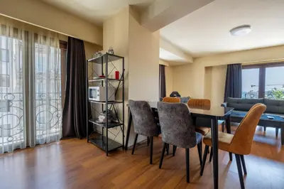 a dining room with a table and chairs at Spacious One Bedroom Apartment with View and Elevator in Istanbul