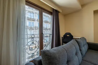a living room with a couch and a window at Spacious One Bedroom Apartment with View and Elevator in Istanbul