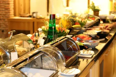 a kitchen counter with a bunch of food on it at Empire Hotel İstanbul in Istanbul