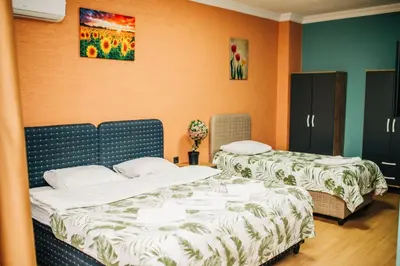 two beds sitting in a room with at Ekinoks Hotel in İznik