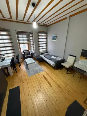 a living room with a couch and a table at Taksim Of The City in Istanbul
