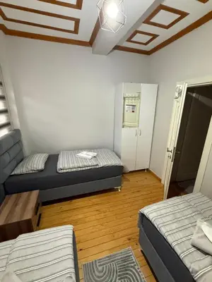a room with two beds and a couch in it at Taksim Of The City in Istanbul