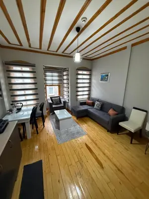 a living room with a couch and a table at Taksim Of The City in Istanbul