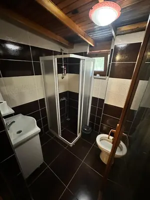 a bathroom with a shower and a toilet at Görkem Suits & Villas in Ocaklar