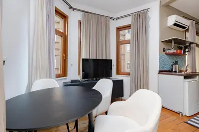 a living room with a black table and chairs at Private Building Featuring Two Separate Apartments in Istanbul