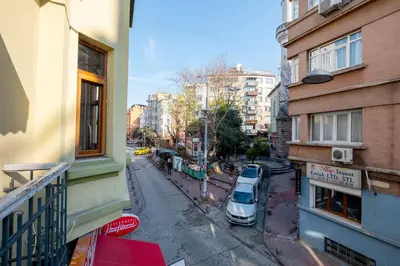 a car parked on a street next to buildings at Private Building Featuring Two Separate Apartments in Istanbul