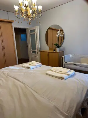 a bedroom with a large white bed with towels on it at Heart of Yesilkoy-Green village in Istanbul