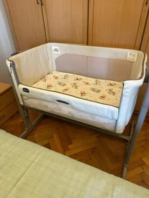 a baby crib with a bed in a room at Heart of Yesilkoy-Green village in Istanbul