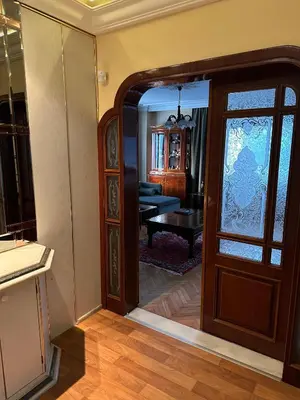 an open door to a living room with a table at Heart of Yesilkoy-Green village in Istanbul