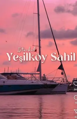 a sailboat in the water with a sunset at Heart of Yesilkoy-Green village in Istanbul
