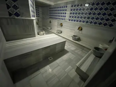 a bathroom with a tub and a toilet at Alrazi Hotel in Istanbul