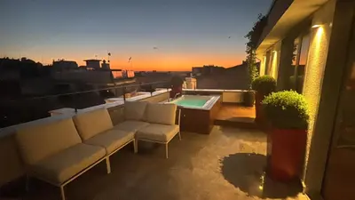 a balcony with chairs and a pool on a building at Taksim Juno Residences in Istanbul
