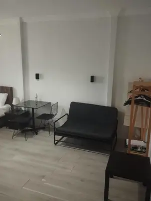 a living room with a couch and a table at Şişli Suites - Room 24 in Istanbul