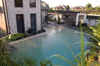 a swimming pool in the backyard of a house at maura beach villas family in Kartepe