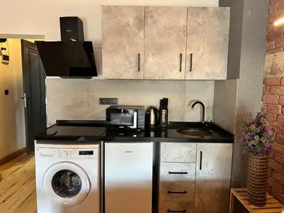 a kitchen with a washing machine and a sink at MorAgop Suites in Istanbul