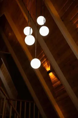 a group of lights hanging from a wooden ceiling at Armoni Life Bungalov in Yanık