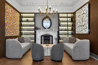 a living room with two chairs and a fireplace at Arbor Hotel - Signature Collection in Istanbul
