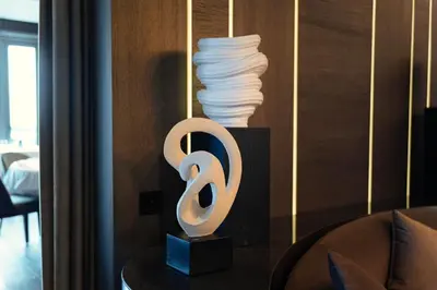 a room with a table with a sculpture on it at Arbor Hotel - Signature Collection in Istanbul