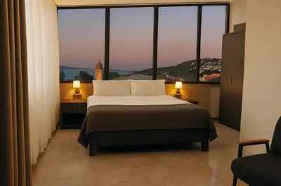 a bedroom with a bed and a large window at Rest By Dedeman Sapanca in Sapanca