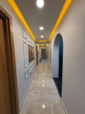 a hallway with white walls and a yellow ceiling at City Hotel İstanbul in Istanbul