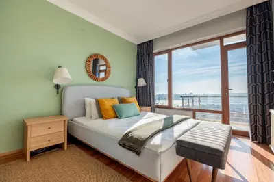 a bedroom with a bed and a large window at Bosphorus View - Central Location - 3 Bedrooms in Istanbul