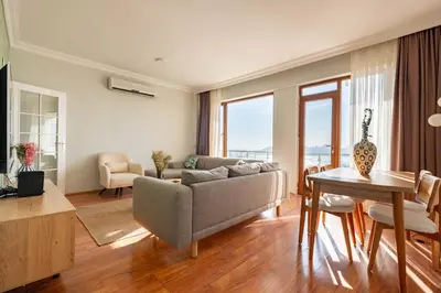 a living room with a couch and a table at Bosphorus View - Central Location - 3 Bedrooms in Istanbul