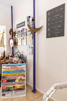a store with a sign on the wall and a counter at Galley Hotel in Istanbul