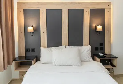 a bedroom with a large white bed with two lamps at Galley Hotel in Istanbul