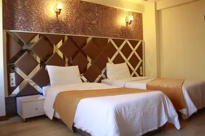 a hotel room with two beds and two lights at Terra Suites in Istanbul