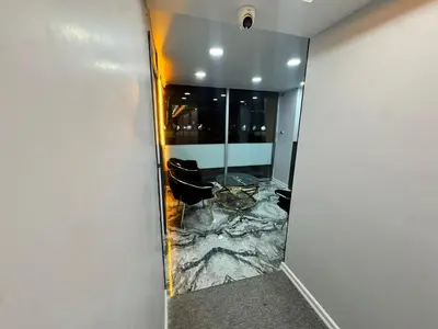 a room with a marble floor and a mirror at QLİNE HOTEL AİRPORT SaW in Istanbul