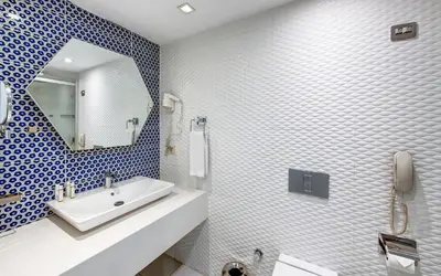 a bathroom with a sink and a mirror at The Elysium Styles Taksim in Istanbul